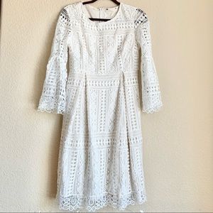 Elegant ivory colored lace dress with bell shaped sleeves size Medium
